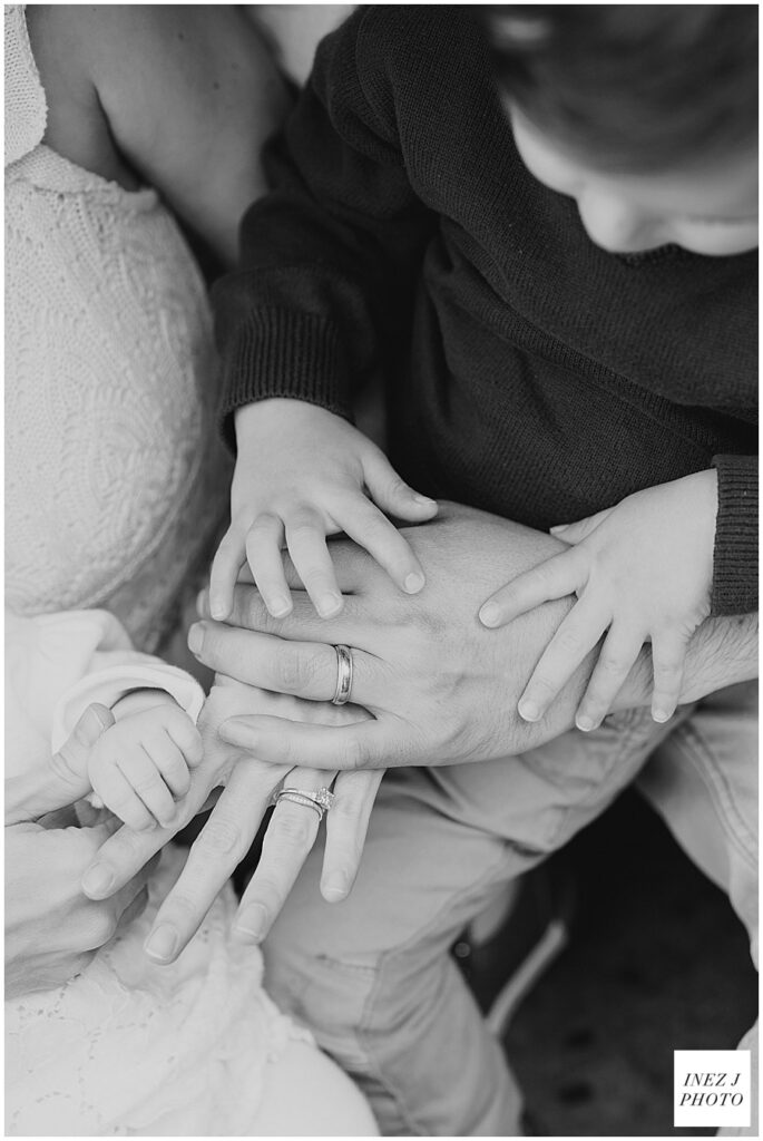 black and white image of family member's hands